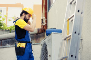 Electrician checking air conditioner